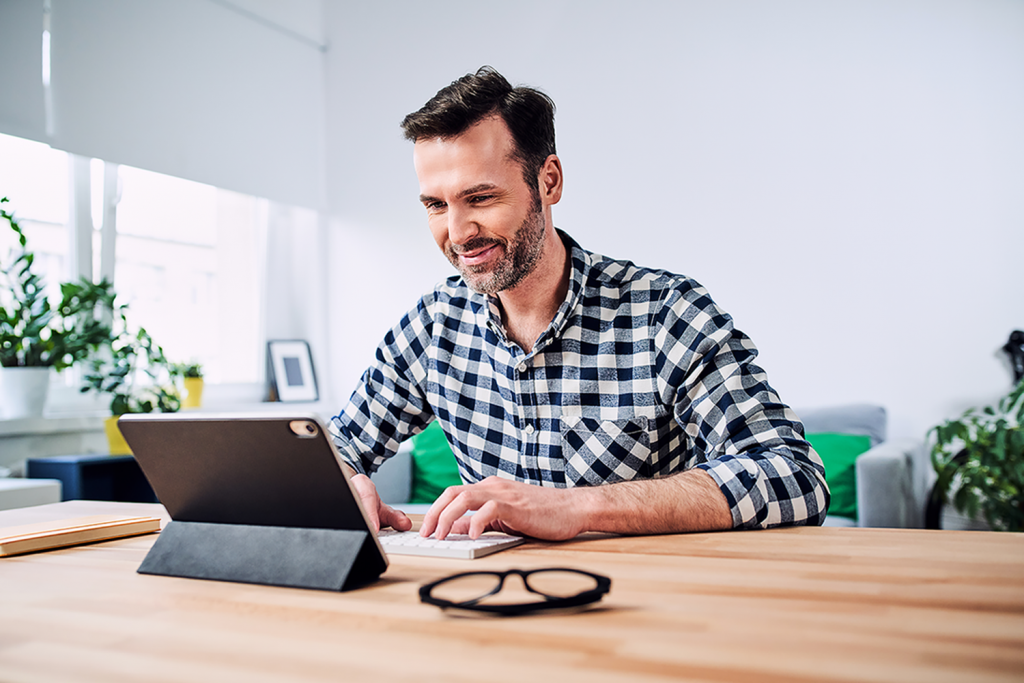 A man works form home on his laptop.