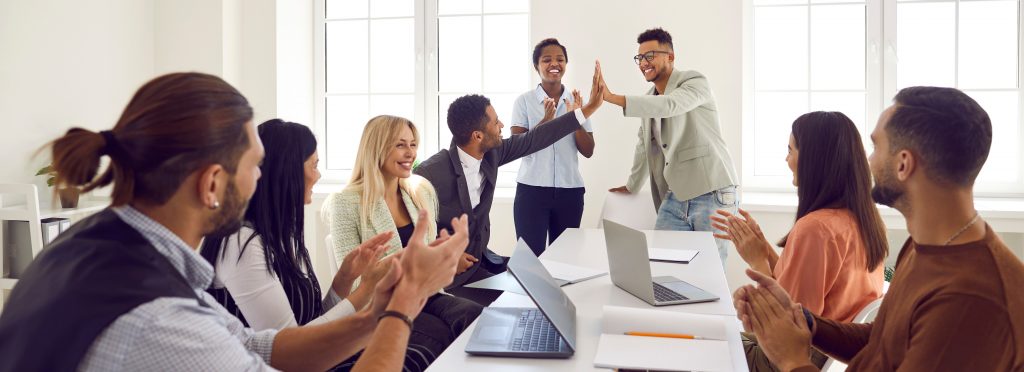 Procurement professionals celebrating a job well done during National Procurement Month.